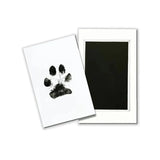 Tampon empreinte patte chien avec fond noir pour des souvenirs d'animaux de compagnie